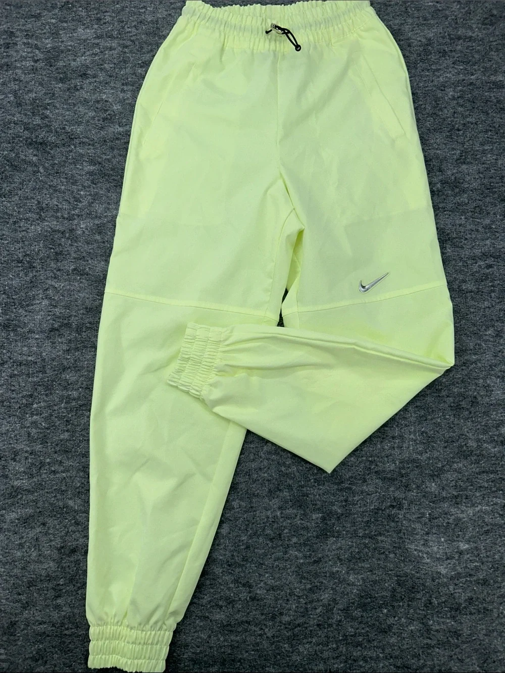 Nike Women's Sportswear Woven Pants in a bright neon green/yellow XS